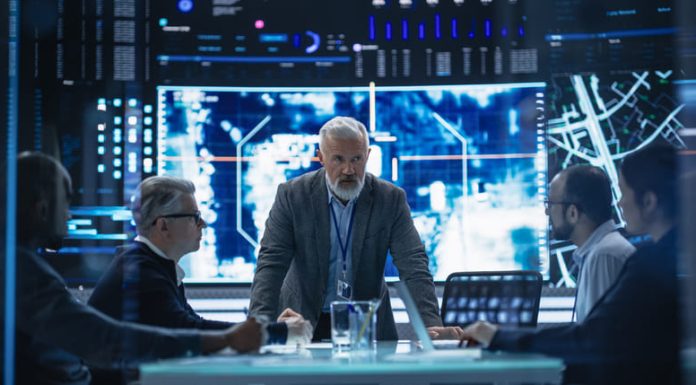 Senior Chief Financial Officer Holding a Meeting with a Group of Fintech Investors/ Digital Transformation