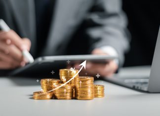 Businessman collecting coins with profit chart analysis business growth, profit growth management and corporate financial statistics
