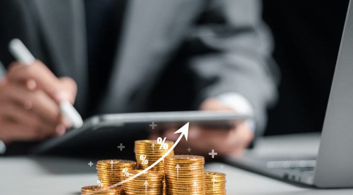 AFG Investments Offers Multi-Device Compatibility for Greater Convenience Businessman collecting coins with profit chart analysis business growth, profit growth management and corporate financial statistics