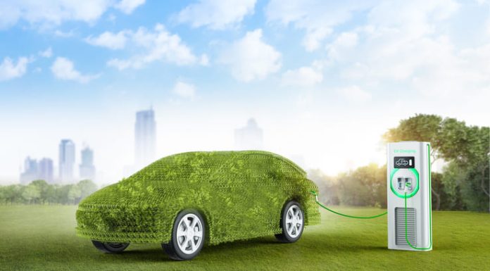 Key EV Trends Set to Define the Market in 2025 Green ev car or leafy grass electric vehicle recharging at station