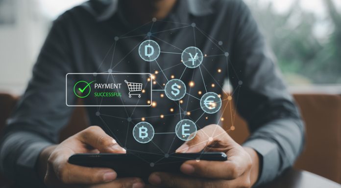 Payment Systems Transformation: A Business Guide Man using a smartphone and credit card to shop online/online payment