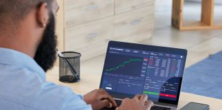 Best Jurisdictions for Crypto Entrepreneurs Laptop, finance and stock market with a man broker working in his office for trading investment or growth