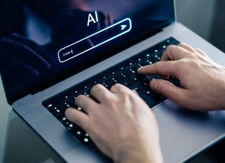 Man using chatbot with laptop at work. Creative content. Generate text or image. Command input on website.