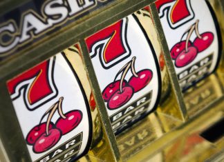 Slot machine reels with cherries and 7s