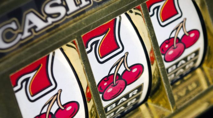 Slot machine reels with cherries and 7s