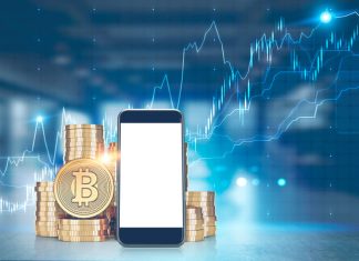 How to Make Passive Income with Crypto in 2025 Pile of bitcoins with a large mock up screen smartphone in the foreground