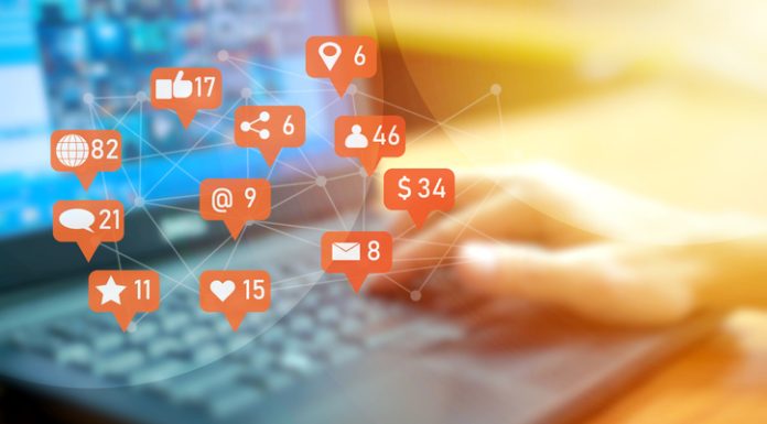 Adapting to Algorithm and UX Changes: Why Your Social Media Strategy Must Evolve with the Platforms Businessman using laptop with social media notifications on screen
