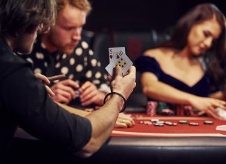 group of people playing igaming in casino together.