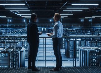 How Data Localization Laws are Changing the Way Companies Operate Data Center IT Specialist and e-Business Enrepreneur Talk, Use Laptop.