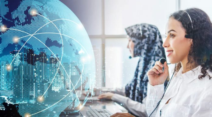 How to Offer Customer Support to Global Customers Beautiful business woman wearing microphone working at office as a telemarketing customer service agent with globe line networking connection.