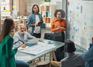 How to Better Understand Your Market to Drive Business Growth Multiethnic Business Team Discussing Strategy and market in a Meeting Room at the Office