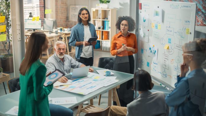 iStock-1482199209 (1) Multiethnic Business Team Discussing Strategy and market in a Meeting Room at the Office