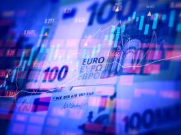 Euro banknotes with stock market chart graph