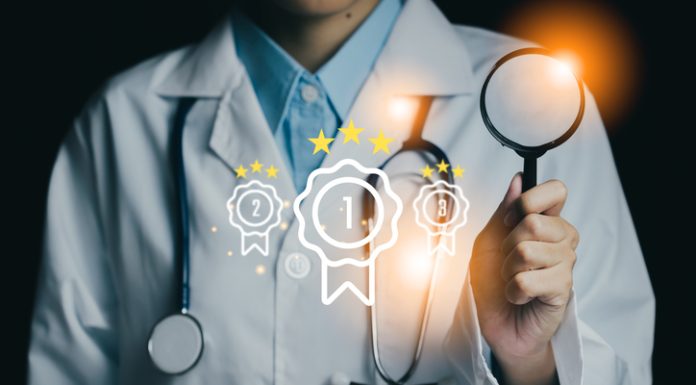 Medical professional holding a magnifying glass device , symbolizing quality and excellence in healthcare.