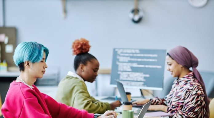 Are Businesses Failing to Adapt to Gen Z? Young generation using computer in office