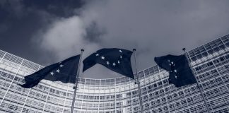 Flags of the European Union in front of the EU-commission building "Berlaymont" in Brussels, Belgium
