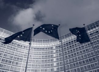 Flags of the European Union in front of the EU-commission building "Berlaymont" in Brussels, Belgium
