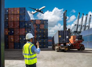 Foreman control loading Containers box to truck for Logistic Import and cargo