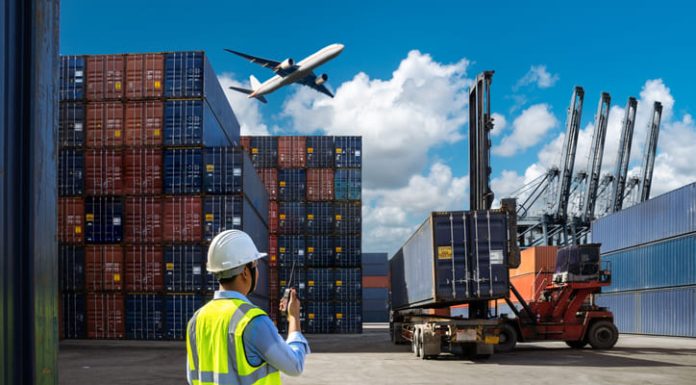 Foreman control loading Containers box to truck for Logistic Import and cargo