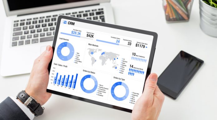 Financial advisor examining the graph on tablet