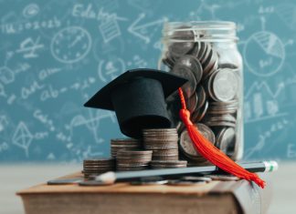 MBA cap on stack of coins