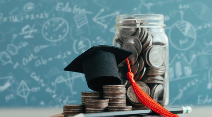 MBA cap on stack of coins