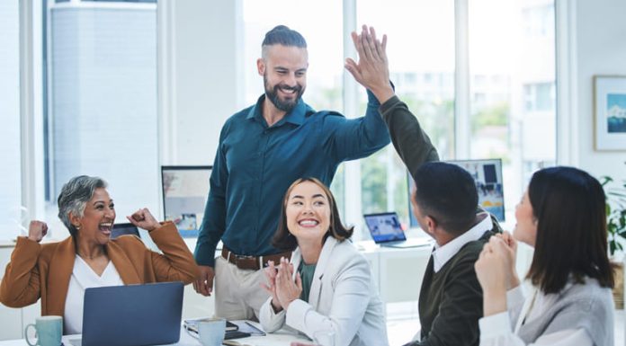 Business team celebrating success. Leader with Emotional intelligence