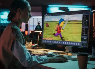 Portrait of Female Video Game Designer Working on a New 3D model app Her Desktop Computer.