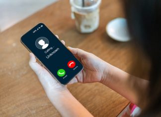 Why Non-VoIP Numbers Are the Future of Online Privacy Human use smartphone with incoming call from unknown numbers