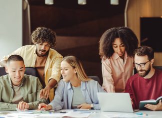 How to Turn Gen Z’s Career Chaos Into an Opportunity Diverse team of young Gen Z professionals collaborating on a project in a modern office