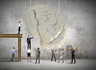 4 Ways to Sharpen Your Thinking and Stay Relevant in the Age of AI Huge human brain and many little businesspeople around. Concept of thinking new ideas