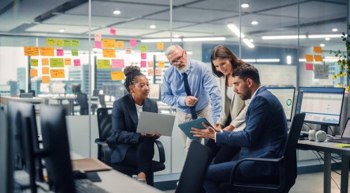 Best 5 Digital PR Agencies in 2025 for SEO-Driven Link Campaigns In Modern Office: Diverse Team of Managers Use Laptop and Tablet Computers at a Company Meeting Discussing Link Campaigns and Business Projects.