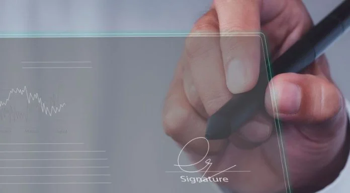 Businessman use electronic pen sign signature on electronic