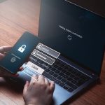 Person typing pin to log in