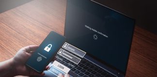 Person typing pin to log in