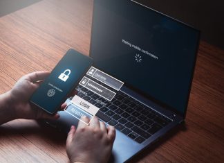 Person typing pin to log in