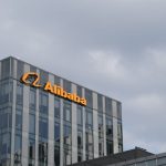 How to Source Smarter on Alibaba UK: 7 Strategies That Work Alibaba company office building and brand logo.