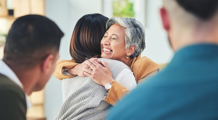 Corporate men, staff and colleagues with embrace for team building, lead, welcome and happy together