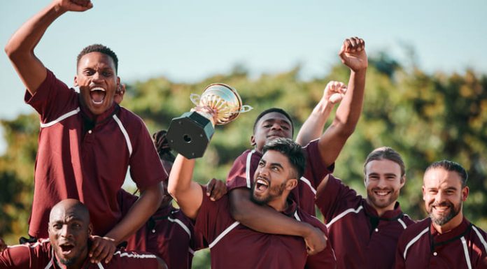 The Amazing Caribbean Premier League and the Special Flavor of Caribbean Cricket Cricket players celebrating, cheering and holding trophy at competition.