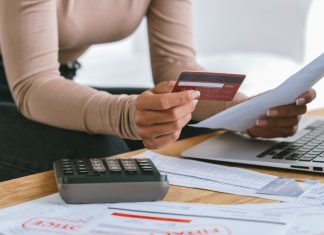 Stressed young woman has financial problems credit card