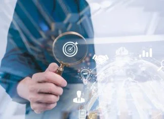 Rethinking Visibility: Competing in a Connected Economy Business development businessman using Magnifier glass focus to target icon which for planning development leadership, visibility and customer target group