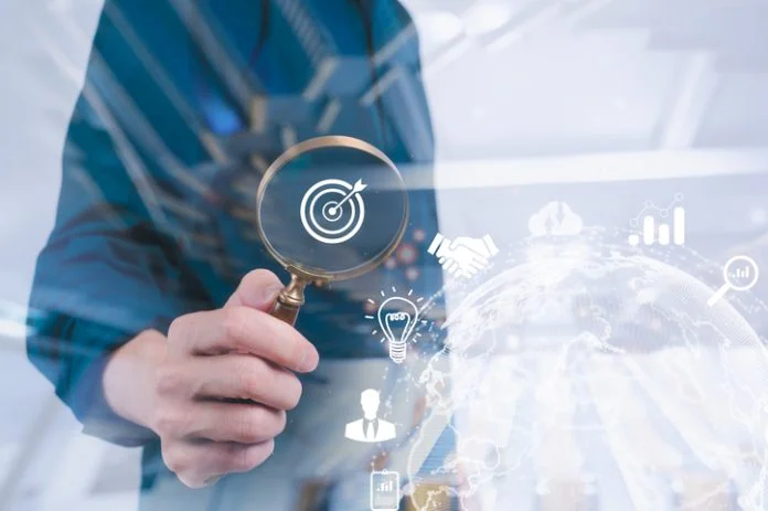 business development businessman using Magnifier glass focus to target icon which for planning development leadership and customer target group concept Business development businessman using Magnifier glass focus to target icon which for planning development leadership, visibility and customer target group