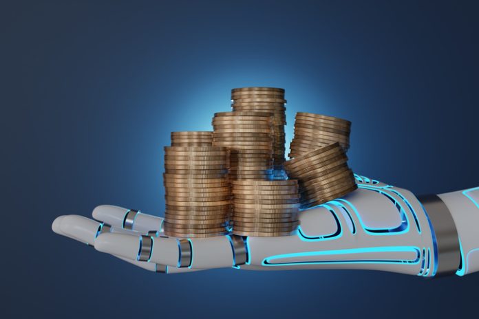 Stacks of gold coins on a white robotic hand in dark blue background. Illustration of the concept of financial and industrial revolution by artificial intelligence (AI) Coins on robot hand for financial, portfolio management and industrial revolution by artificial intelligence (AI)