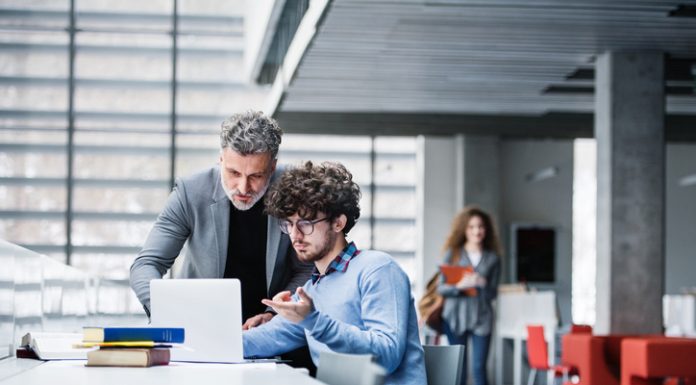 MBA student and professor checking a recommendations