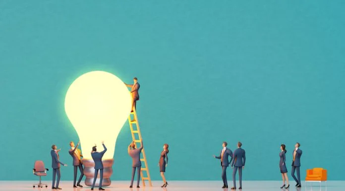 Team of experiences professional people are working around big light bulb for PDSA project