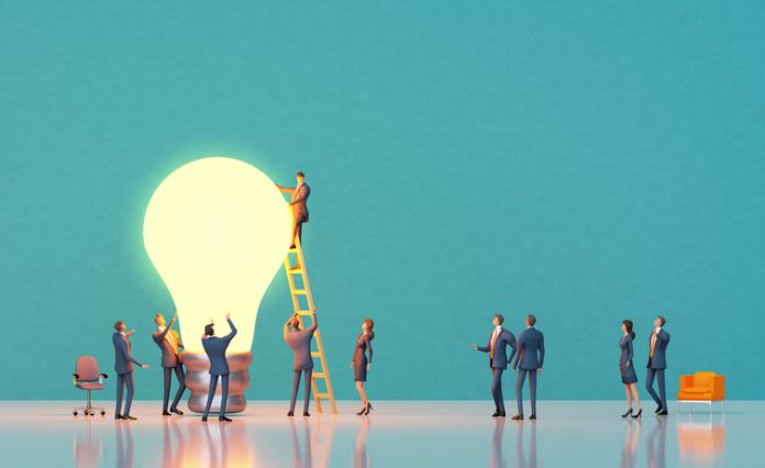 Team of experiences professional people are working around big light bulb for PDSA project