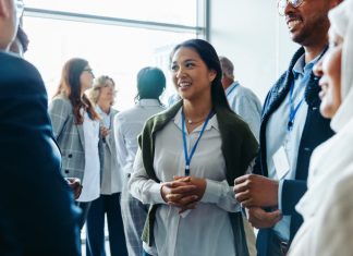 Corporate event with diverse attendees enjoying refreshments and networking