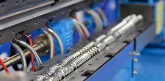 Twin screw plastic Extrusion machine close up.