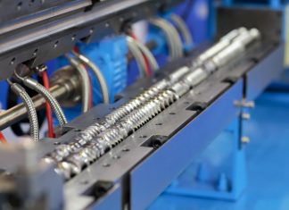 Twin screw plastic Extrusion machine close up.