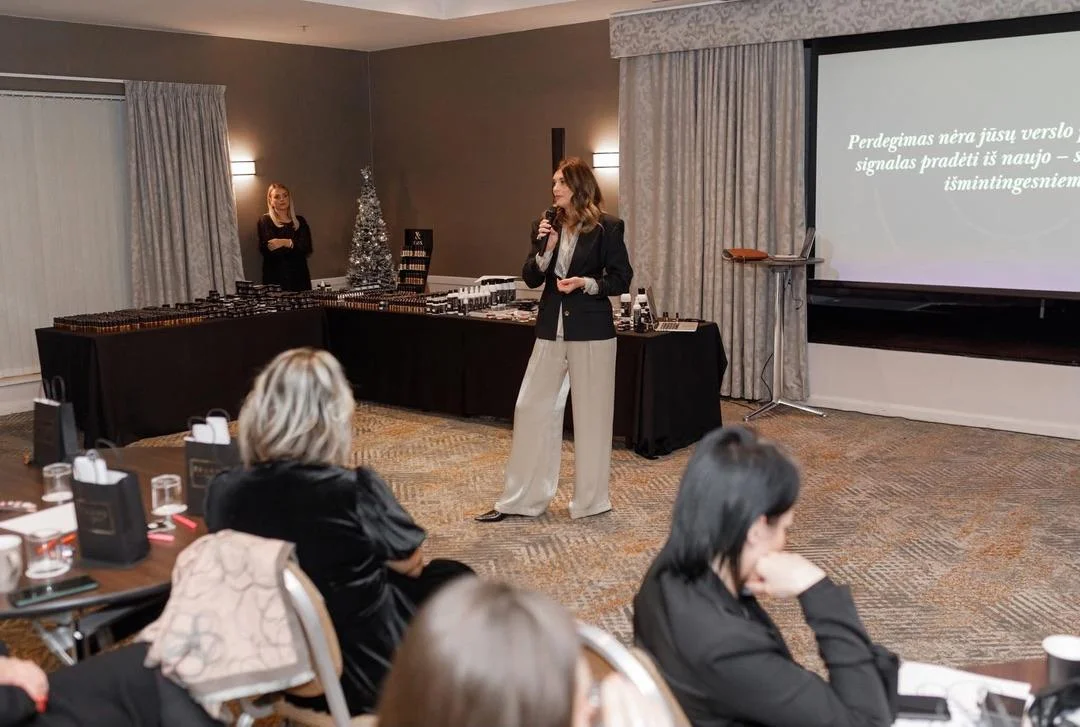 Ausra Sajonaite speaking in a conference